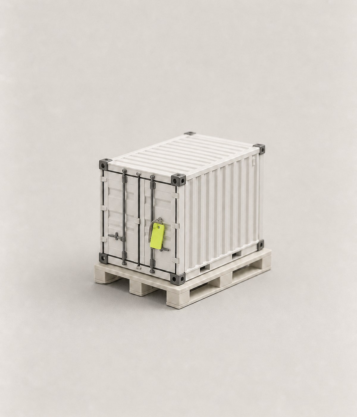 A sealed miniature cargo container with a lime tag.