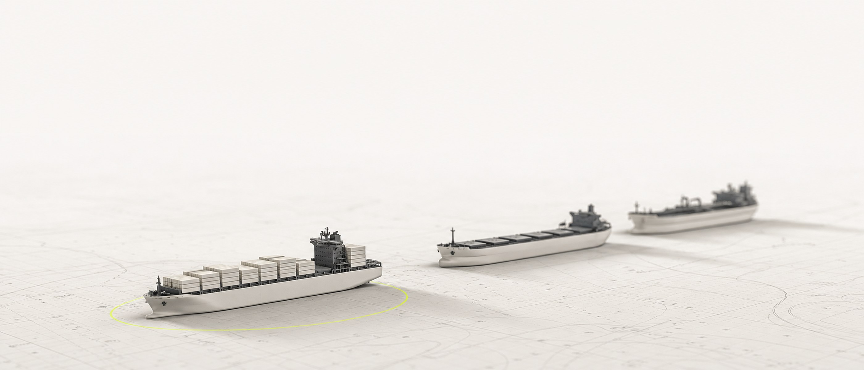 Three miniature vessels at anchor on a pale navigation chart.
