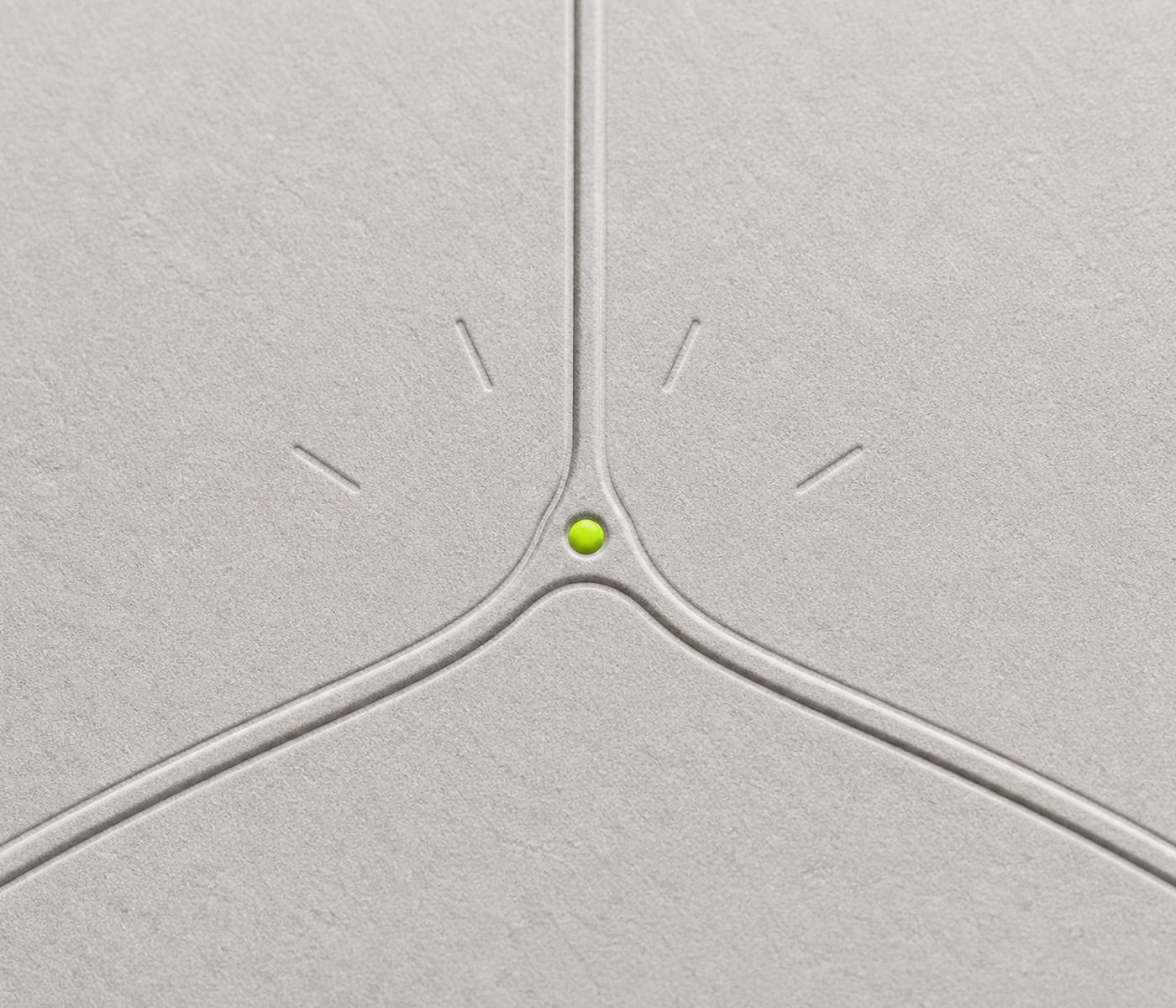 Three engraved channels converging at a lime junction bead.