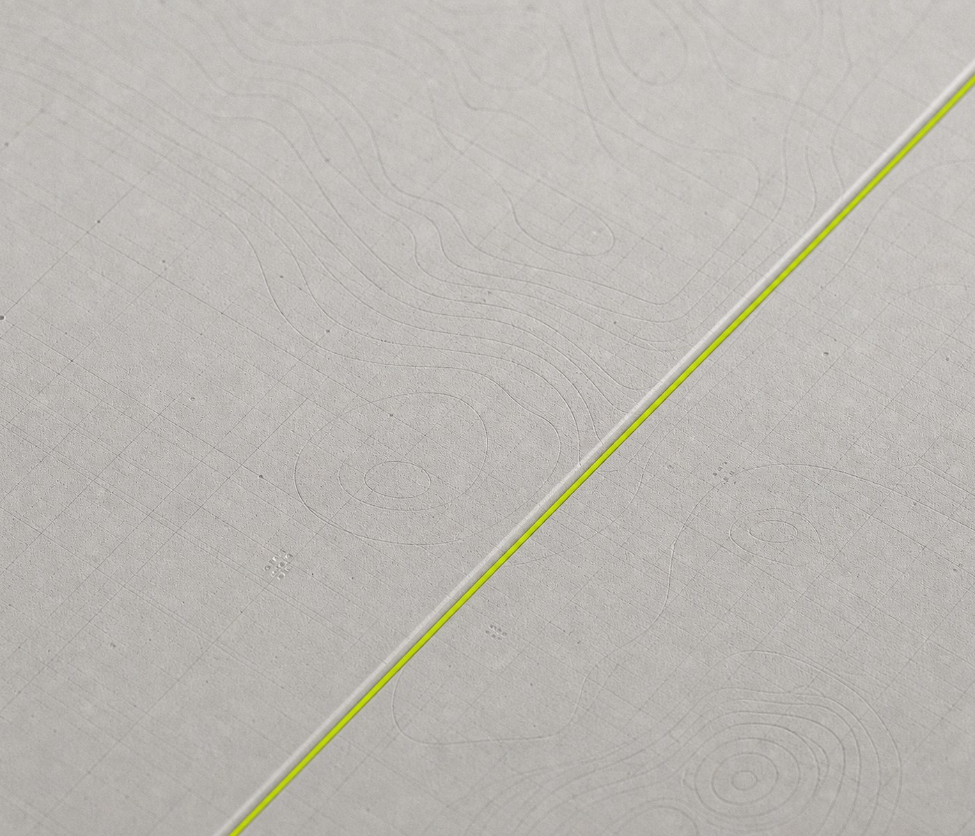 Two machined chart plates divided by a lime-lit seam.